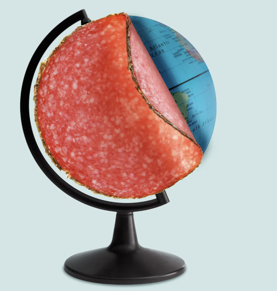 globe covered by a slice of deli meat